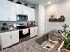 Well-equipped kitchen featuring granite countertops and white cabinets at 3074 Distant Rock Ave, Castle Rock, CO 80109