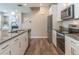 Beautiful kitchen features stainless steel appliances and granite countertops at 3074 Distant Rock Ave, Castle Rock, CO 80109