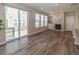 Bright living room features a fireplace, plush seating, and access to the outdoor balcony at 3074 Distant Rock Ave, Castle Rock, CO 80109