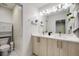 Well-lit bathroom with a double vanity, modern fixtures, and ample storage at 2922 W 26Th Ave # 4, Denver, CO 80211