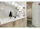 Stylish bathroom featuring a double vanity, walk-in shower, and modern design at 2922 W 26Th Ave # 4, Denver, CO 80211