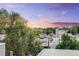 Scenic neighborhood view showcases lush greenery, rooftops, and distant mountains at 2922 W 26Th Ave # 4, Denver, CO 80211