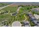 Stunning aerial view showcasing the neighborhood pond and lush green spaces near the home at 3554 E 143Rd Pl, Thornton, CO 80602