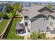 Aerial view of backyard with a gazebo, patio, green lawn, and fenced perimeter at 3554 E 143Rd Pl, Thornton, CO 80602