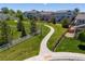 Green backyard and path in a Gathering-friendly neighborhood at 3554 E 143Rd Pl, Thornton, CO 80602
