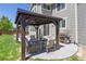 Backyard patio featuring a gazebo with outdoor seating and a barbecue grill at 3554 E 143Rd Pl, Thornton, CO 80602