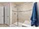 Walk-in shower with bench seating, glass door and neutral tile work at 3554 E 143Rd Pl, Thornton, CO 80602