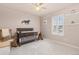 Comfortable Bedroom with natural light, neutral tones, rocking chair, and pony motif at 3554 E 143Rd Pl, Thornton, CO 80602