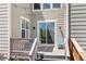 Charming deck features a sliding glass door and outdoor seating with string lights at 3554 E 143Rd Pl, Thornton, CO 80602
