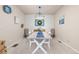 Formal dining room with stylish furniture, a large wood table, and a modern light fixture, perfect for entertaining at 3554 E 143Rd Pl, Thornton, CO 80602