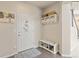 Functional entryway with a shoe bench, wall-mounted storage, and a convenient space for coats and accessories at 3554 E 143Rd Pl, Thornton, CO 80602