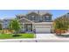 Inviting exterior of a two-story home with a well-manicured lawn and a spacious two-car garage at 3554 E 143Rd Pl, Thornton, CO 80602