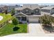 Charming two-story home with a well-maintained lawn, inviting front porch, and two-car garage at 3554 E 143Rd Pl, Thornton, CO 80602