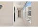 Bright hallway with natural light and neutral decor creates a welcoming transition between rooms at 3554 E 143Rd Pl, Thornton, CO 80602