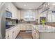 Bright kitchen featuring granite countertops, stainless steel appliances, and pendant lighting at 3554 E 143Rd Pl, Thornton, CO 80602