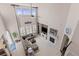 Overhead view of a cozy living room with a fireplace, comfortable seating, and plenty of natural light at 3554 E 143Rd Pl, Thornton, CO 80602