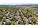Overhead view of a mature tree-lined neighborhood near major roadways and open land at 11370 Iola St, Commerce City, CO 80640