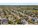 Aerial view shows a home in a sprawling suburban neighborhood with mature landscaping at 11370 Iola St, Commerce City, CO 80640
