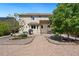 Back of house featuring a wooden pergola, gravel landscaping, and outdoor grill at 11370 Iola St, Commerce City, CO 80640
