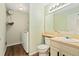 Bathroom featuring vinyl floors, single vanity, and a washer and dryer at 11370 Iola St, Commerce City, CO 80640