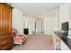 Bonus room with a reading nook with ornate chair and space for a home office at 11370 Iola St, Commerce City, CO 80640