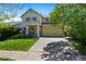 Charming two-story home with a well-maintained lawn and inviting front porch at 11370 Iola St, Commerce City, CO 80640