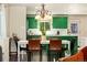 Bright kitchen featuring unique green cabinets and an open floor plan at 11370 Iola St, Commerce City, CO 80640