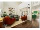 Bright living room featuring two-story ceilings, stylish seating, and an open floor plan at 11370 Iola St, Commerce City, CO 80640