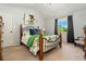 Serene bedroom with high ceilings, comfortable bed, and large window for natural lighting at 11370 Iola St, Commerce City, CO 80640
