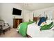 Well lit main bedroom featuring a queen bed and a relaxing space at 11370 Iola St, Commerce City, CO 80640