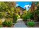 Landscaped backyard pathway leading to the house at 4425 King St, Denver, CO 80211