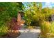 Landscaped backyard with a winding gravel pathway at 4425 King St, Denver, CO 80211