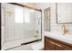 Clean bathroom with white tile and a modern vanity at 4425 King St, Denver, CO 80211