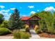 Charming craftsman home with a red roof and landscaped front yard at 4425 King St, Denver, CO 80211