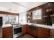 Modern kitchen with stainless steel appliances and quartz countertops at 4425 King St, Denver, CO 80211