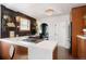 Updated kitchen with marble counters and dark cabinetry at 4425 King St, Denver, CO 80211