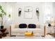 Stylish living room featuring a comfy sofa and large mirror at 4425 King St, Denver, CO 80211