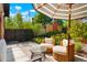 Relaxing patio with seating area and umbrella at 4425 King St, Denver, CO 80211