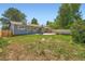 Large backyard featuring a patio area with a basketball hoop and plenty of room for activities at 2615 S Laredo Ct, Aurora, CO 80013