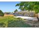 Spacious backyard with a patio, perfect for outdoor gatherings and featuring a basketball hoop at 2615 S Laredo Ct, Aurora, CO 80013