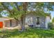 Charming home featuring mature landscaping and a well-maintained front yard, creating curb appeal at 2615 S Laredo Ct, Aurora, CO 80013