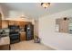 Functional kitchen featuring modern appliances, tile flooring and good counter space at 2615 S Laredo Ct, Aurora, CO 80013