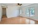 Bright living room features hardwood floors, large windows, and ample natural light, creating an inviting space at 2615 S Laredo Ct, Aurora, CO 80013