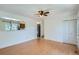 Spacious living room with hardwood floors, neutral walls and open view to the kitchen at 2615 S Laredo Ct, Aurora, CO 80013
