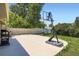Concrete patio area with a basketball hoop, suitable for entertaining and outdoor enjoyment at 2615 S Laredo Ct, Aurora, CO 80013
