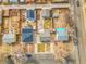 An aerial view shows several residential homes and neighborhood streets on a sunny day at 1681 Nome St, Aurora, CO 80010