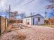 Backyard with garden beds, shed, a swing set, and gravel groundcover offers space and recreation at 1681 Nome St, Aurora, CO 80010