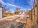 Backyard with prepared garden beds and a detached garage is designed for easy gardening and outdoor fun at 1681 Nome St, Aurora, CO 80010