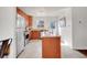 Bright kitchen featuring stainless steel appliances and ample cabinet space, with an island and granite countertops at 1681 Nome St, Aurora, CO 80010