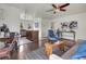 Comfortable living room flows into a charming kitchen with warm wood tones and a modern feel at 1681 Nome St, Aurora, CO 80010